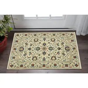 Photo of Ivory Blue And Brown Oriental Area Rug With Fringe