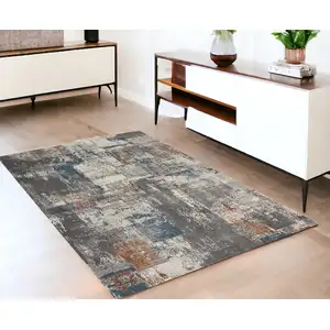 Photo of Ivory Blue And Gray Abstract Area Rug