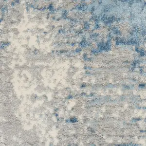 Photo of Ivory Blue And Gray Abstract Distressed Area Rug