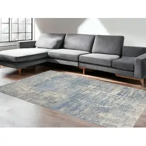 Photo of Ivory Blue And Gray Abstract Distressed Area Rug