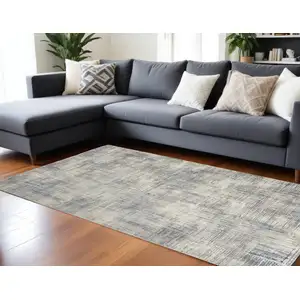 Photo of Ivory Blue And Gray Abstract Distressed Area Rug