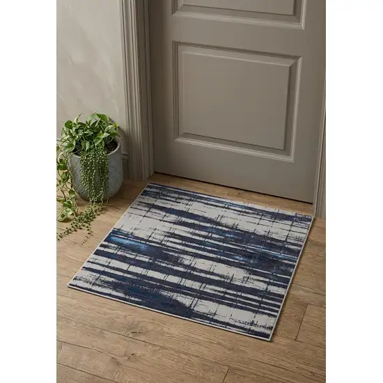 Ivory Blue And Gray Abstract Power Loom Distressed Area Rug Photo 1