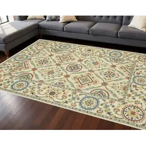 Photo of Ivory Blue And Red Oriental Area Rug With Fringe