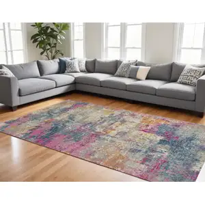 Photo of Ivory Blue And Yellow Abstract Area Rug