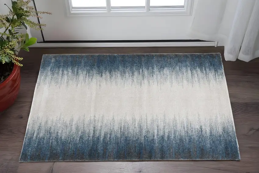 Ivory And Blue Abstract Area Rug Photo 1