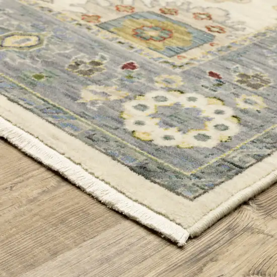 Ivory Blue Grey Teal Gold Green And Rust Oriental Power Loom Stain Resistant Area Rug With Fringe Photo 5