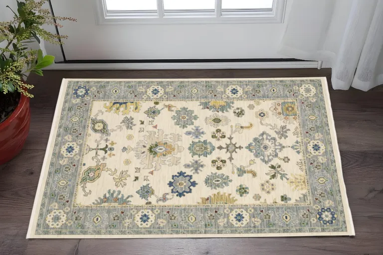 Ivory Blue Grey Teal Gold Green And Rust Oriental Power Loom Stain Resistant Area Rug With Fringe Photo 2