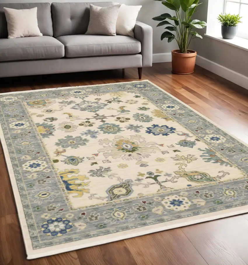 Ivory and Blue Oriental Power Loom Area Rug With Fringe Photo 1