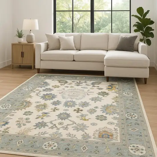 Ivory Blue Grey Teal Gold Green And Rust Oriental Power Loom Stain Resistant Area Rug With Fringe Photo 1