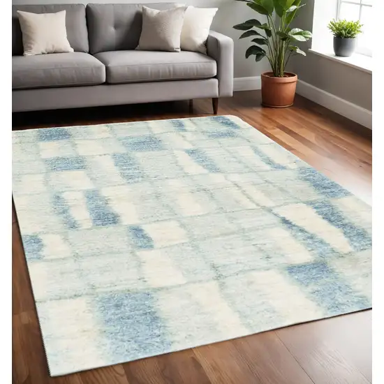 Ivory And Blue Abstract Area Rug Photo 1