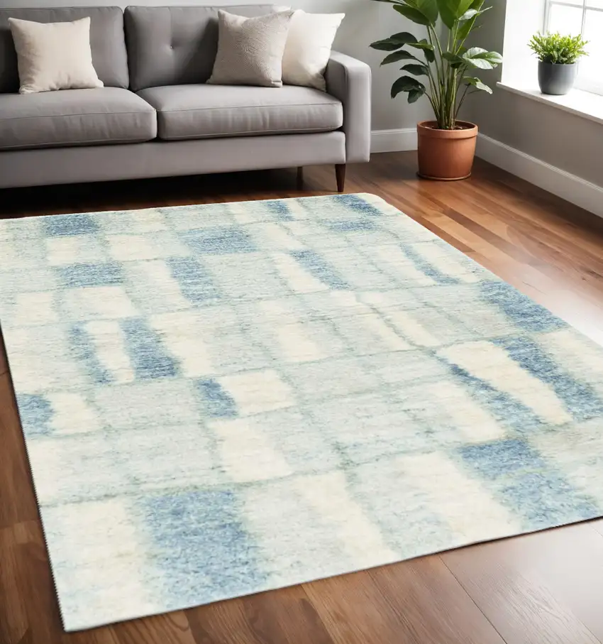 Ivory And Blue Abstract Area Rug Photo 1