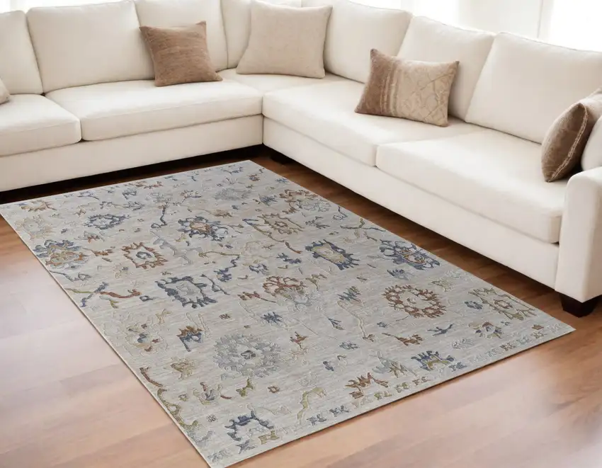 Ivory Blue and Gold Floral Power Loom Worn Faded Area Rug With Fringe Photo 1