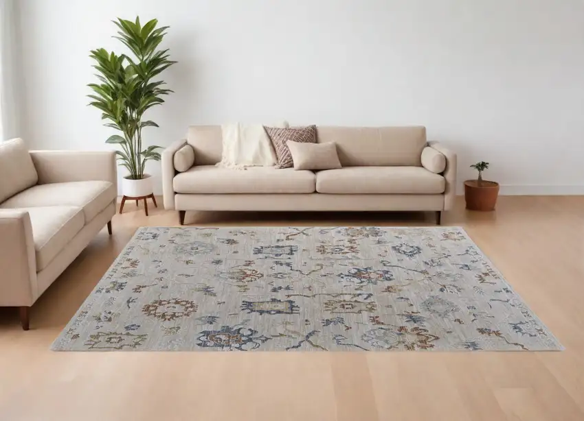 Ivory Blue and Gold Floral Power Loom Worn Faded Area Rug With Fringe Photo 1