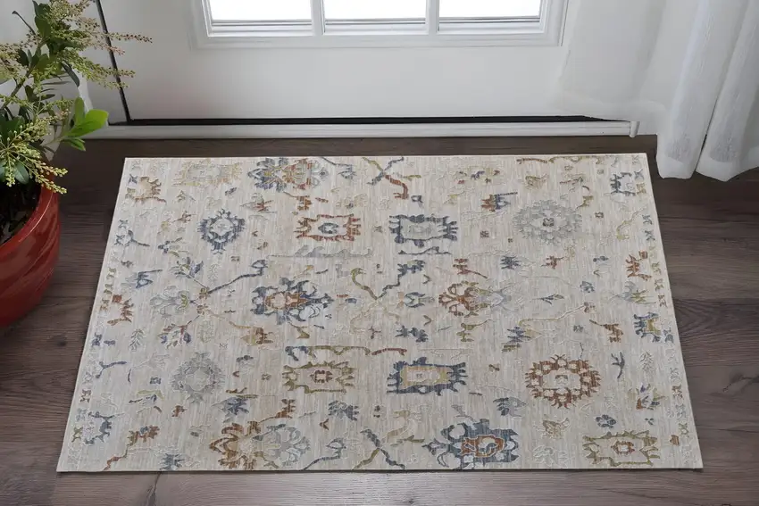 Ivory Blue and Gold Floral Power Loom Worn Faded Area Rug With Fringe Photo 1