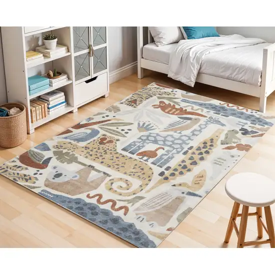 5' X 7' Ivory Blue and Gray Animal Print Washable Area Rug Photo 1