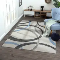 Photo of Ivory Blue and Gray Geometric Area Rug