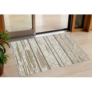 Photo of Ivory Brown And Beige Striped Washable Indoor Outdoor Area Rug