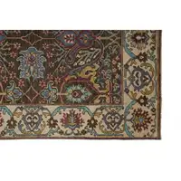 Photo of Ivory Brown And Blue Wool Floral Hand Knotted Distressed Stain Resistant Area Rug With Fringe