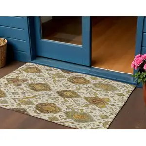 Photo of Ivory Brown And Gold Ikat Washable Indoor Outdoor Area Rug