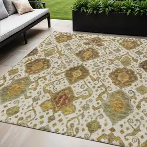 Photo of Ivory Brown And Gold Ikat Washable Indoor Outdoor Area Rug