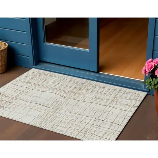 Ivory Brown And Gold Striped Washable Indoor Outdoor Area Rug Photo 1