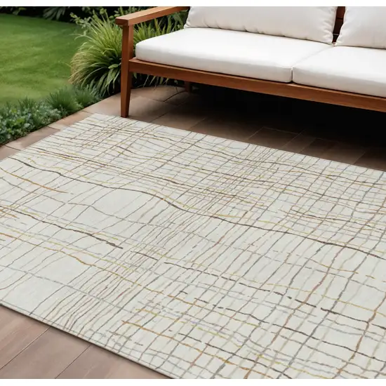 Ivory Brown And Gold Striped Washable Indoor Outdoor Area Rug Photo 1