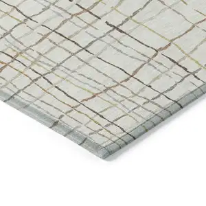 Photo of Ivory Brown And Gold Striped Washable Indoor Outdoor Area Rug