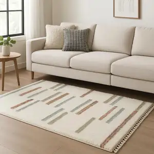 Photo of Ivory Brown And Gray Striped Shag Area Rug With Fringe