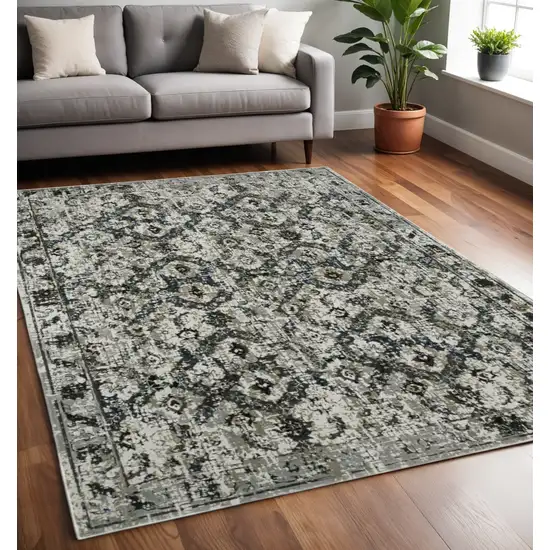 Ivory and Black Oriental Power Loom Area Rug Photo 1