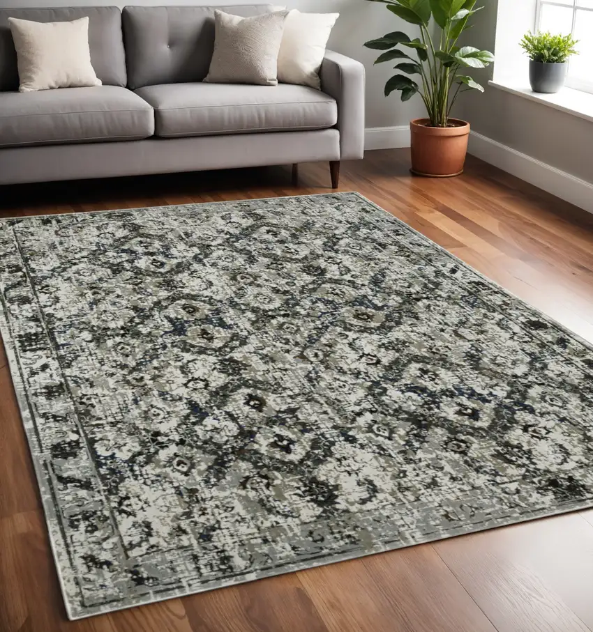 Ivory and Black Oriental Power Loom Area Rug Photo 1