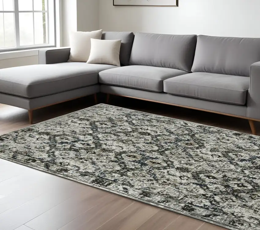 Ivory and Black Oriental Power Loom Area Rug Photo 1