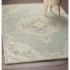 Photo of Ivory Distressed Floral Area Rug
