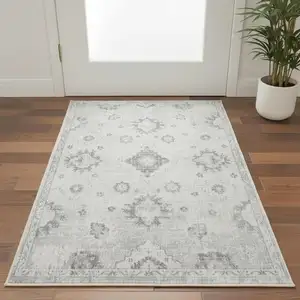 Photo of Ivory Floral Power Loom Worn Faded Area Rug
