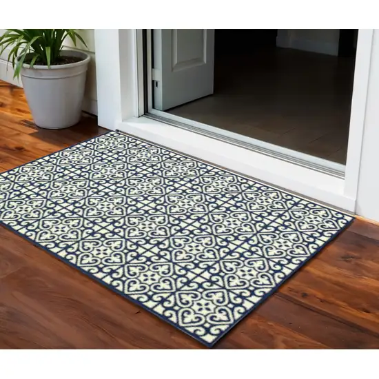 Ivory and Blue Geometric Stain Resistant Indoor Outdoor Area Rug Photo 1
