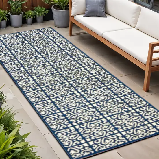 Ivory and Blue Geometric Stain Resistant Indoor Outdoor Area Rug Photo 1