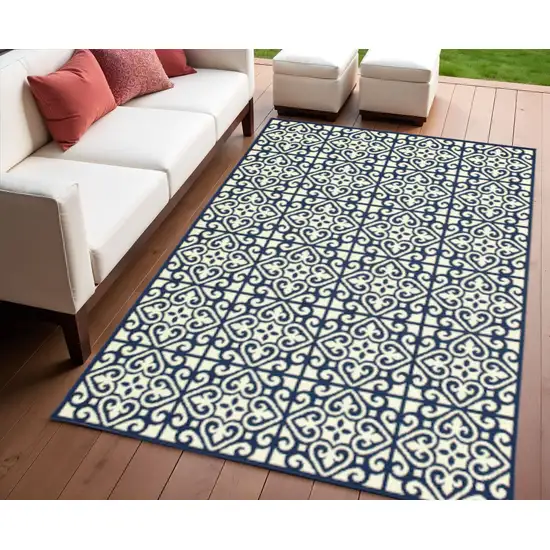 Ivory and Blue Geometric Stain Resistant Indoor Outdoor Area Rug Photo 1