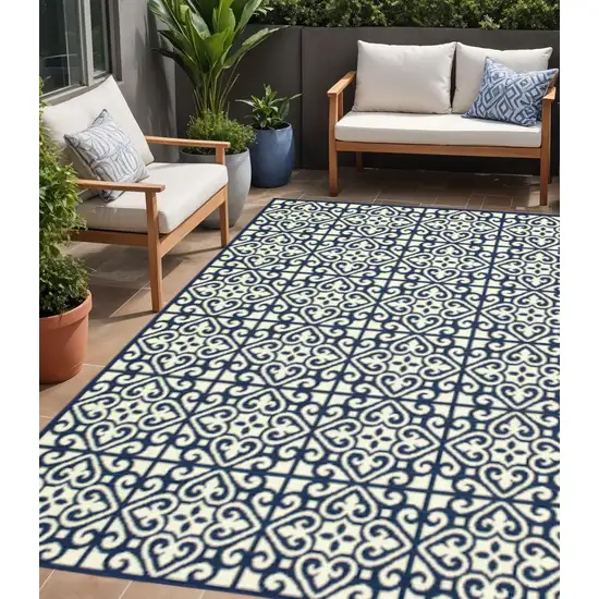 Ivory and Blue Geometric Stain Resistant Indoor Outdoor Area Rug Photo 1
