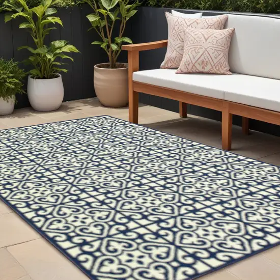 Ivory and Blue Geometric Stain Resistant Indoor Outdoor Area Rug Photo 1