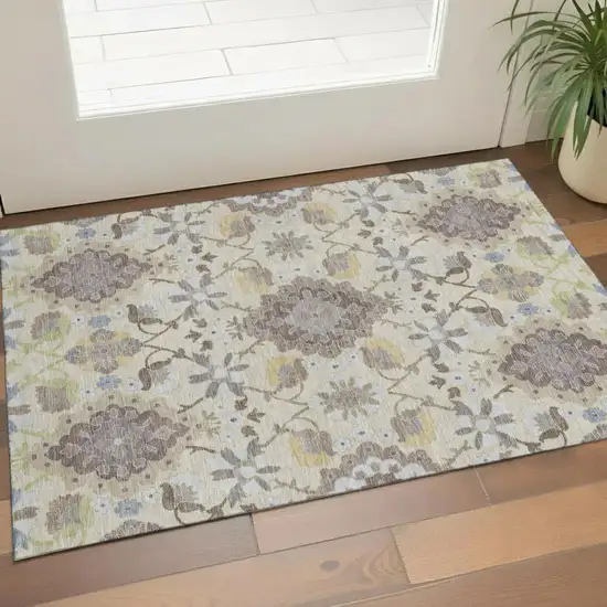 Ivory Gold And Beige Oriental Washable Area Rug With UV Protection Photo 1