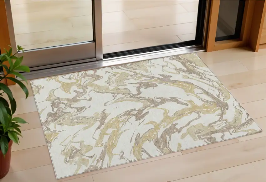 Ivory Gold And Brown Abstract Washable Indoor Outdoor Area Rug Photo 1