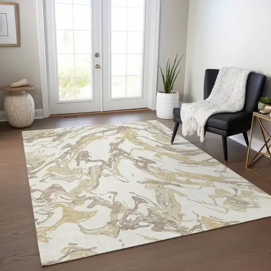 Ivory Gold And Brown Abstract Washable Indoor Outdoor Area Rug Photo 9
