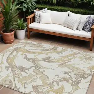 Photo of Ivory Gold And Brown Abstract Washable Indoor Outdoor Area Rug