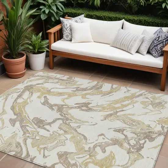 Ivory Gold And Brown Abstract Washable Indoor Outdoor Area Rug Photo 1