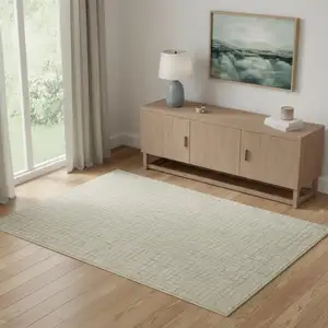 Photo of Ivory Gold And Gray Abstract Geometric Washable Area Rug
