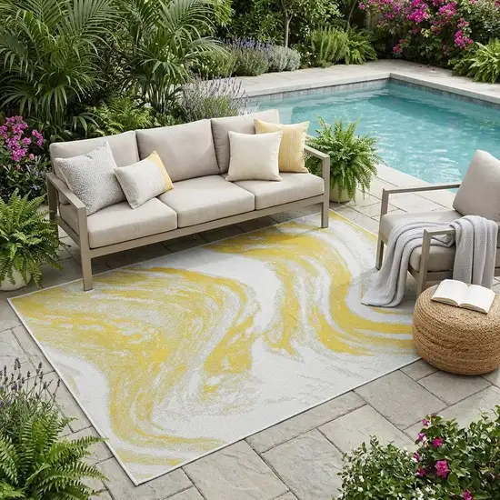 Gold And Ivory Abstract Indoor Outdoor Area Rug Photo 1