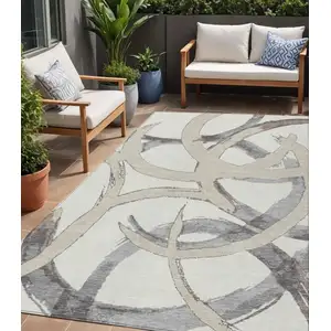 Photo of Ivory Gray And Beige Abstract Washable Indoor Outdoor Area Rug