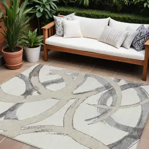 Photo of Ivory Gray And Beige Abstract Washable Indoor Outdoor Area Rug
