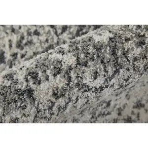 Photo of Ivory Gray And Black Abstract Power Loom Area Rug