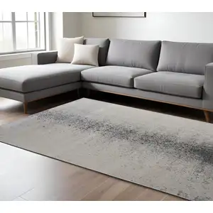 Photo of Ivory Gray And Black Abstract Power Loom Area Rug