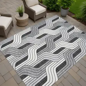 Photo of Ivory Gray And Black Striped Washable Indoor Outdoor Area Rug